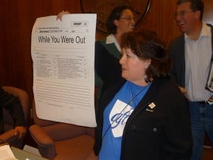 AFT's pversized telephone message tells legislators "budget cuts will hurt all of our kids and employees." 