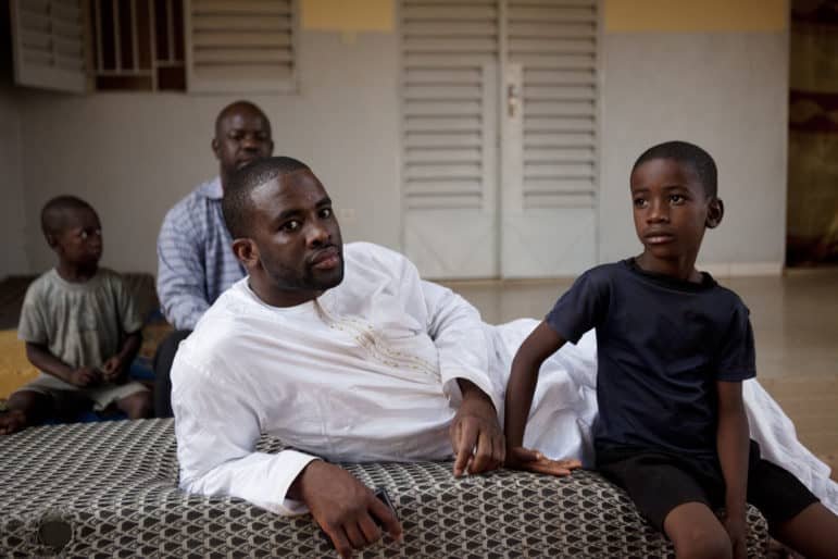 Harouna Touré arrived back in Mali in September 2014, after spending five years in prison in the United States. He and his childhood friend, Idriss Abdelrahman, seated in back, had been accused of being al-Qaida operatives. A federal judge rejected that accusation.