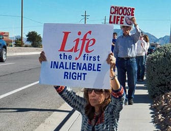 A scene from a recent demonstration against abortion in Las Cruces. The author pledges that his organization will redouble our efforts to advance a climate of nonjudgmental understanding and peaceful non-violence.